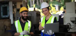 Engineer on site working for production or maintenance big machine industry in factory