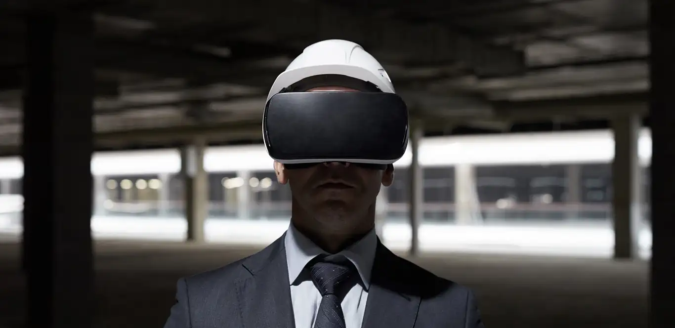 Businessman wearing VR headset at construction site