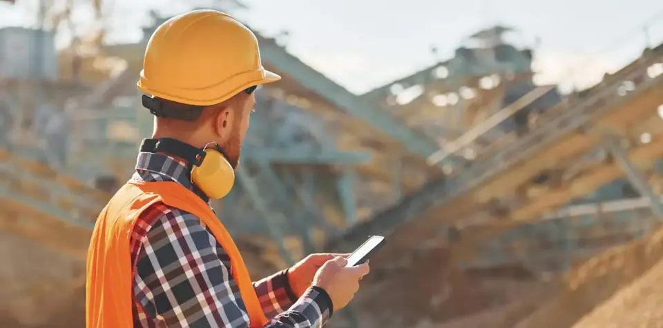 Construction worker with headphones on