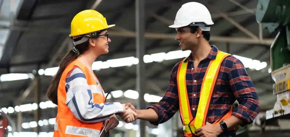 Foreman and worker shaking hands