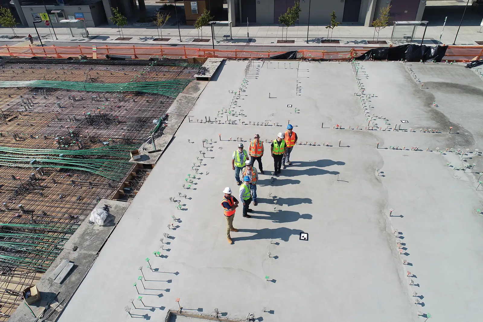 Project managers on jobsite inspecting foundation