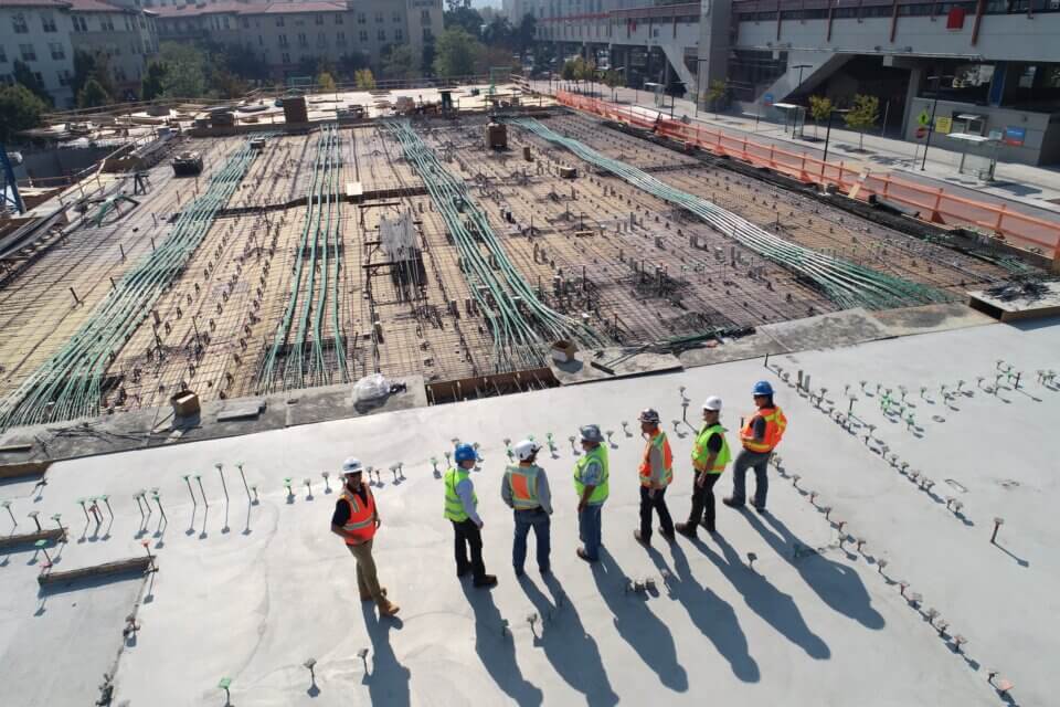 group of workers standing on a construction site