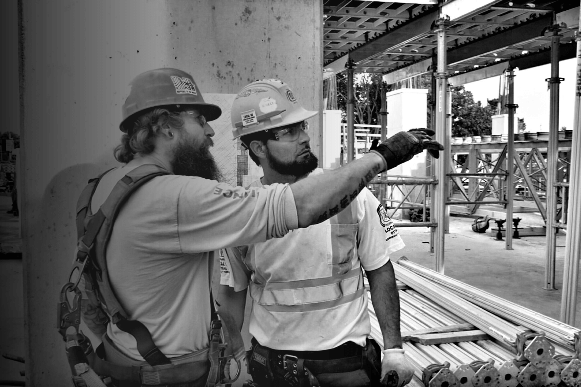 black and white photo of two construction workers