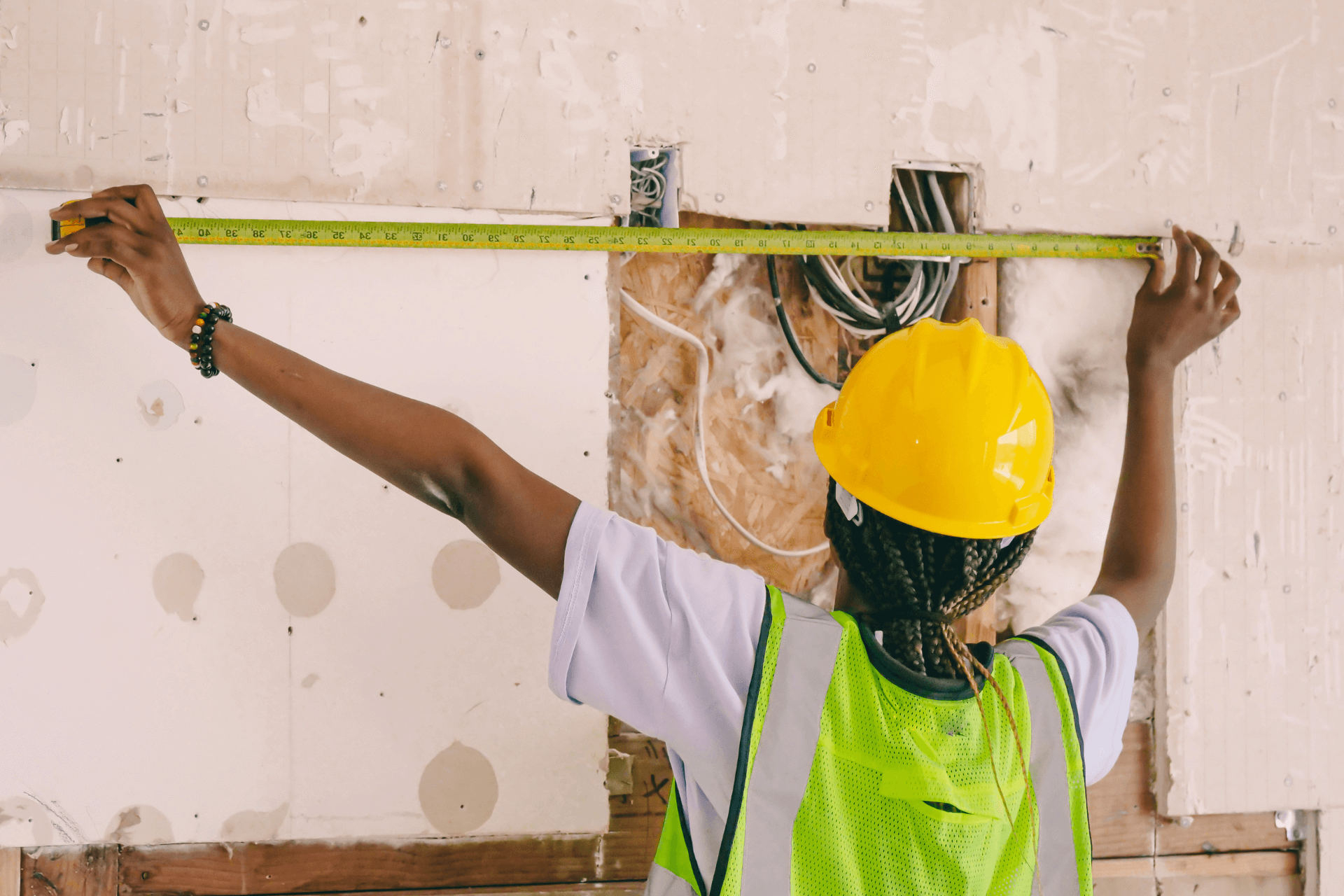 construction worker measuring