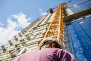 safety inspector standing at the bottom of the crane